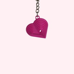 3D printed heart keychains in green, orange, magenta and yellow with layered ring design